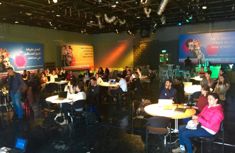 Participants take part in the Women Wage Peace Hackathon (photo credit: WOMEN WAGE PEACE)