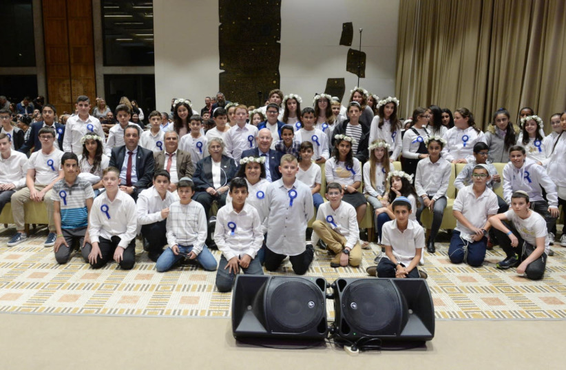 Rivlin hosted a  bar- and batmitzvah event for children of families affected in terrorist attacks. (photo credit: MARK NEIMAN)