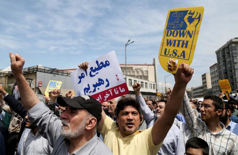 Iranians shout slogans during a protest in Tehran, Iran, against President Donald Trump, May 11, 2018 (photo credit: REUTERS/TASNIM NEWS AGENCY)