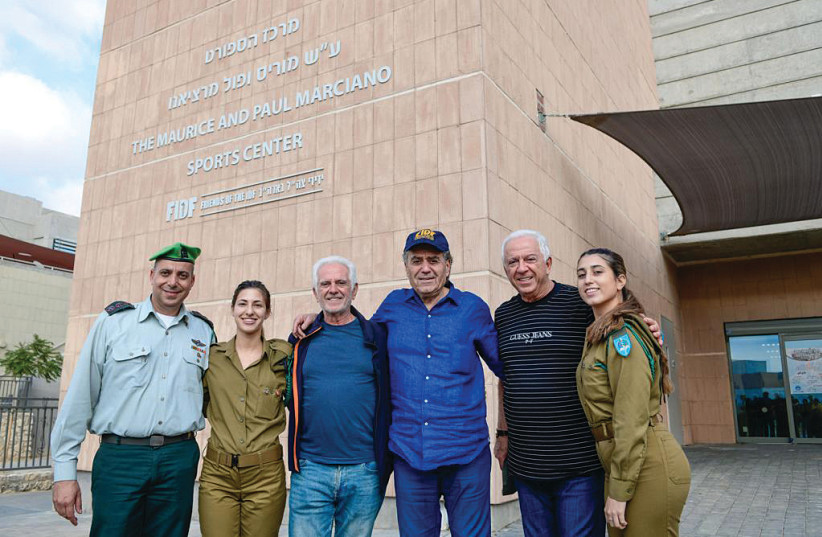 FROM LEFT, Avi Motola, Maurice Marciano, Haim Saban, Paul Marciano with IDF soldiers (photo credit: SHACHAR AZRAN)