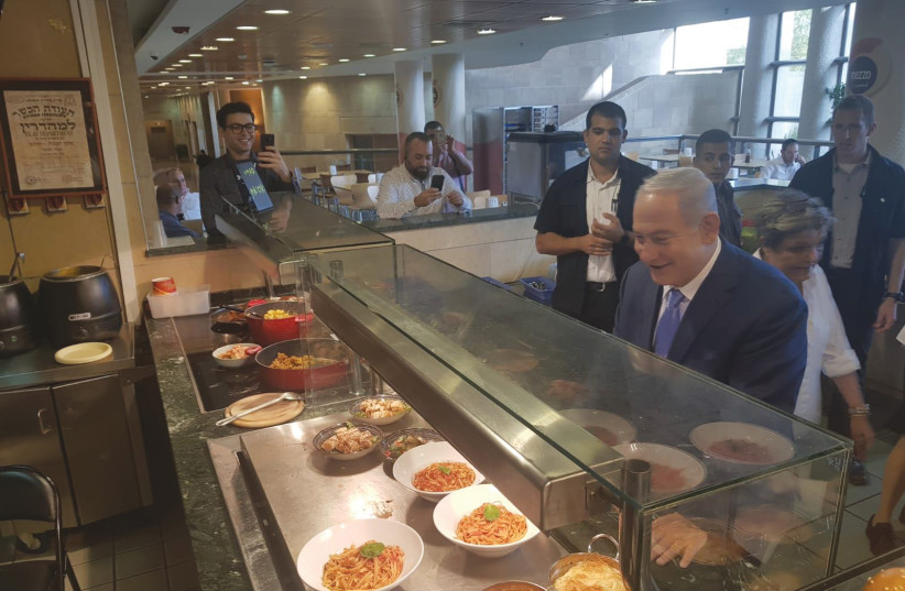 PRIME MINISTER Benjamin Netanyahu celebrate this week’s political victory with a visit to the Knesset cafeteria (photo credit: GPO)