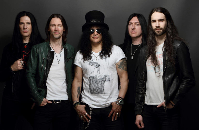 Slash (center), with his band (photo credit: Courtesy)