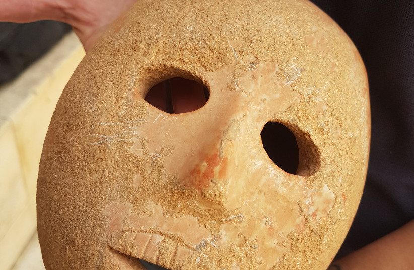 9,000-year-old stone mask discovered in southern Hebron Hills (photo credit: ANTIQUITIES AUTHORITY)