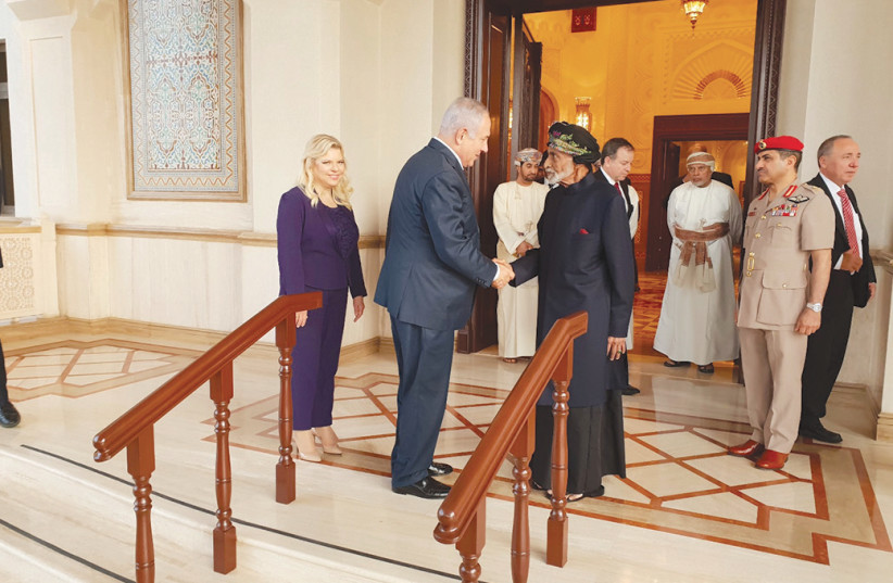 PRIME MINISTER Benjamin Netanyahu meets with Oman’s Sultan Qaboos bin Said al Said in October 2018 (photo credit: REUTERS)