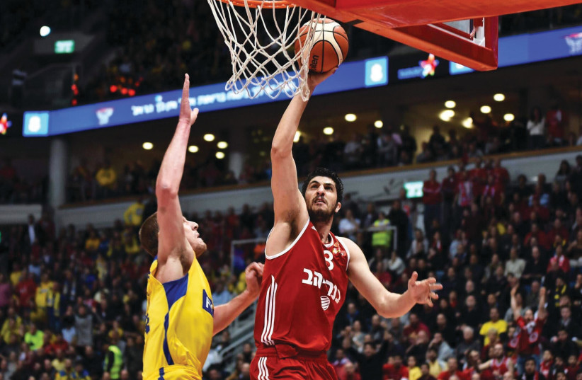 SPARKS ALWAYS fly when Lior Eliyahu (right) and Hapoel Jerusalem duel with Eliyahu's former team, Maccabi Tel Aviv. The two most preeminent Israeli clubs will face each other on Saturday night in Basketball Super Leahue action. (photo credit: DOV HALICKMAN/COURTESY)