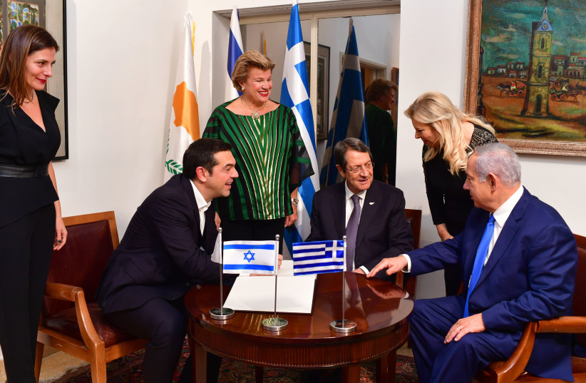 Prime Minister Benjamin Netanyahu and his wife Sara hosted the President of Cyprus Nicos Anastasiades and Greek Prime Minister Alexis Tsipras in their home on Wednesday night.  (photo credit: PMO)
