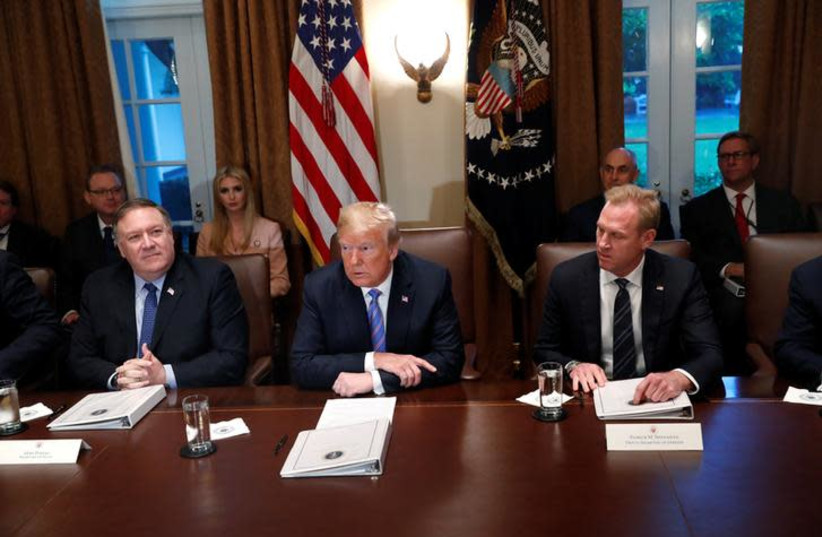 U.S. President Donald Trump participates in a meeting with cabinet members, including Secretary of State Mike Pompeo and Deputy Secretary of Defense Patrick Shanahan, in the Cabinet Room of the White House in Washington, U.S., July 18, 2018 (photo credit: REUTERS/LEAH MILLIS)