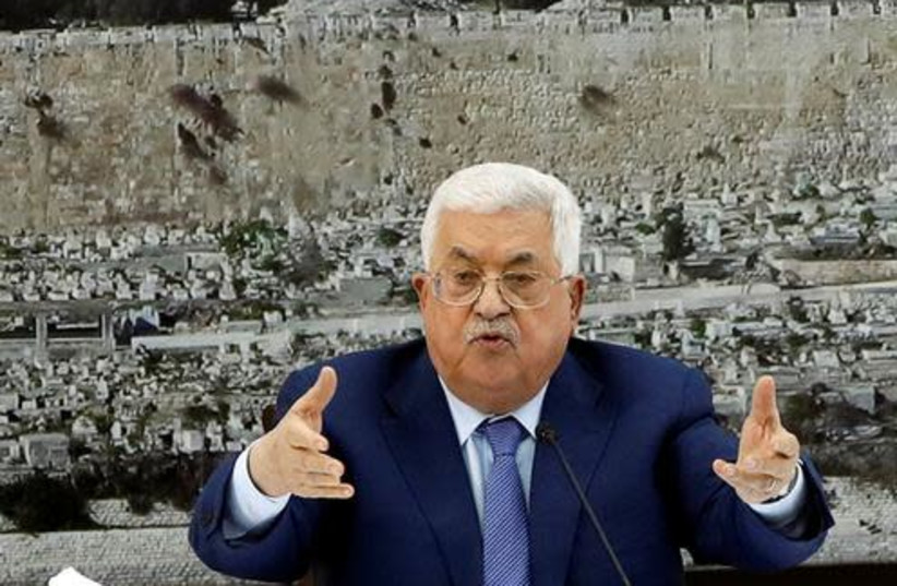 Palestinian President Mahmoud Abbas gestures during a meeting with the Palestinian leadership in Ramallah, in the West Bank December 22, 2018. (photo credit: REUTERS/MOHAMAD TOROKMAN)