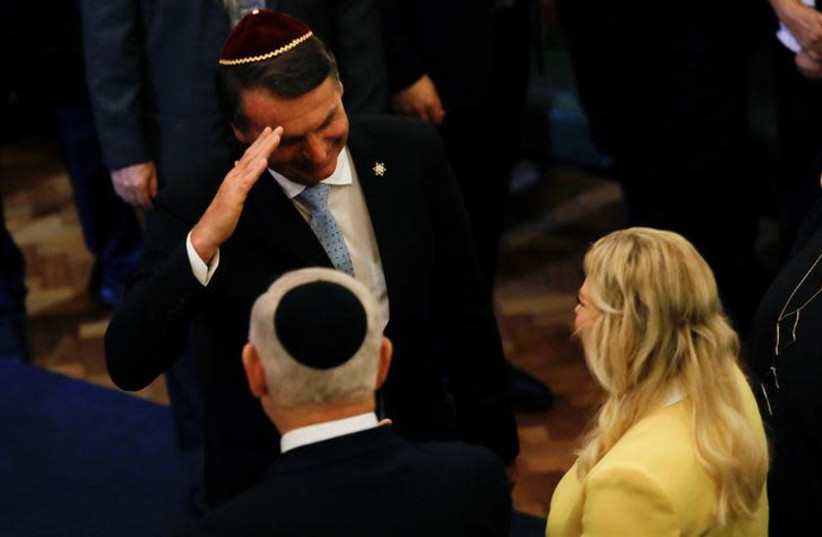 Brazil's President-elect Jair Bolsonaro salutes Israeli Prime Minister Benjamin Netanyahu in a synagogue in Rio de Janeiro, Brazil December 28, 2018. (photo credit: REUTERS)