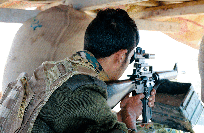 An SDF sniper (photo credit: THE MEDIA LINE)