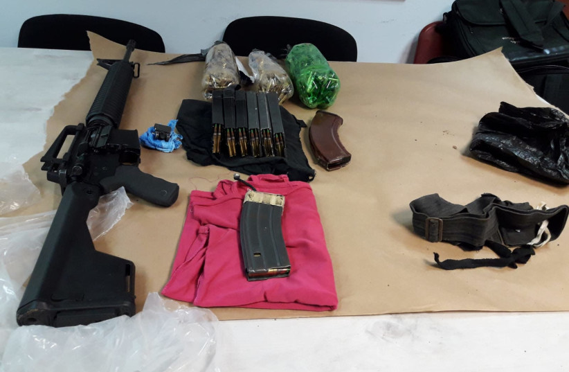 Illustrative image of weapons and ammunition seized by Israel Police (credit: COURTESY ISRAEL POLICE)