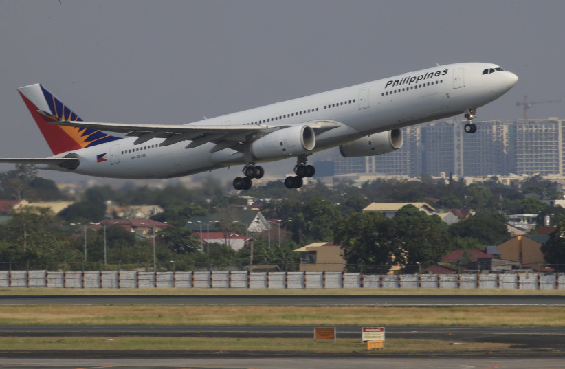 An aircraft of Philippines Airlines (PAL), the southeast asian nation's flag carrier, takeoff at a runway of the Ninoy Aquino International Airport (NAIA) in Manila March 14, 2016 (photo credit: ROMEO RANOCO/REUTERS)