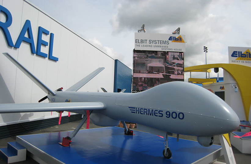Elbit Systems Hermes 900, with the company's logo in the background (photo credit: Wikimedia Commons)