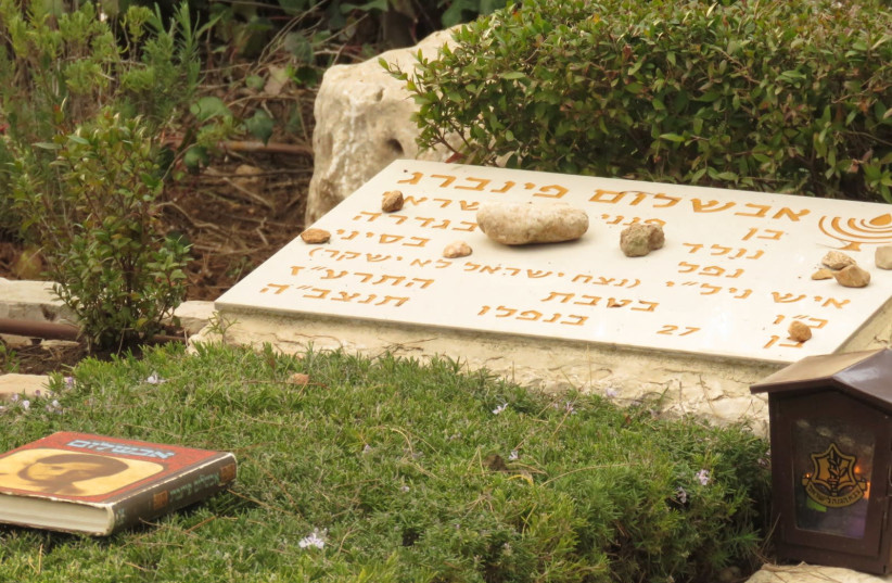 Stones laid in memory of Avshalom Feinberg by right-wing NGO Im Tirtsu members. (photo credit: CHANA KHOURY)