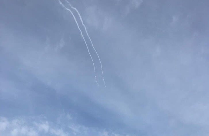 Trails of smoke from the Iron Dome defense system after a rocket was intercepted over the Golan Heights, January 20th, 2019 (photo credit: IDF SPOKESPERSON'S UNIT)