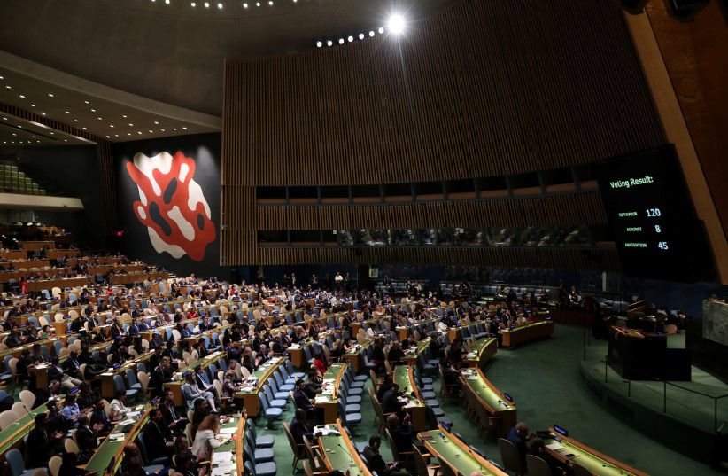 The United Nations General Assembly votes to adopt a draft resolution to deplore the use of excessive force by Israeli troops against Palestinian civilians at U.N. headquarters in New York, U.S., June 13, 2018  (photo credit: REUTERS/MIKE SEGAR)