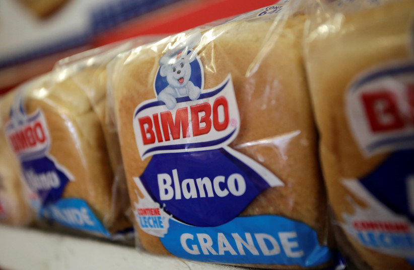 Loaves of bread of Mexican breadmaker Grupo Bimbo are pictured at a convenience store in Monterrey, Mexico, August 6, 2018 (photo credit: DANIEL BECERRIL/REUTERS)