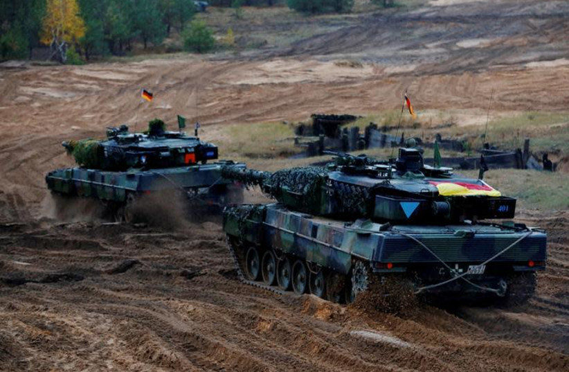 German Leopard 2 tanks of the NATO enhanced Forward Presence battle goup attend Iron Tomahawk exercise in Adazi, Latvia (photo credit: REUTERS/INTS KALNINS)