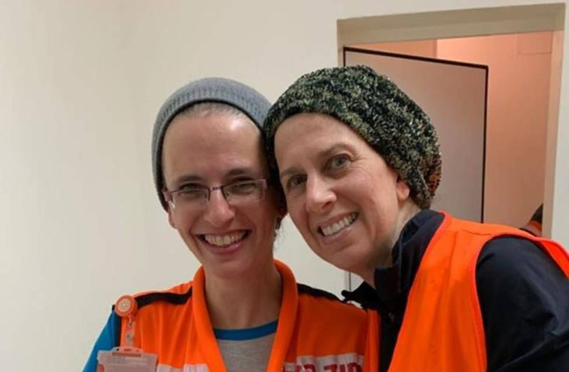 Allison Rosenbaum and Ruthie Printz of the United Hatzalah Midwives Unit with a newborn baby in Beit Shemesh, January 27, 2019 (photo credit: UNITED HATZALAH‏)