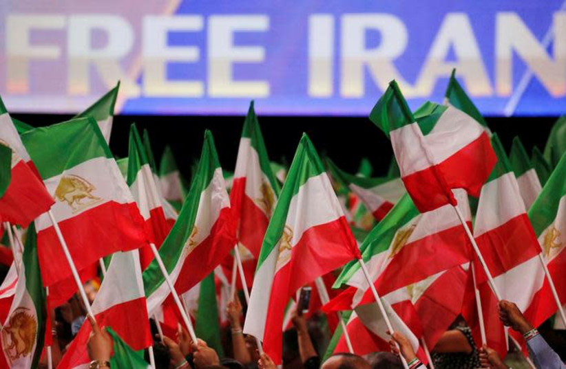Supporters of Maryam Rajavi, president-elect of the National Council of Resistance of Iran (NCRI), attend a rally in Villepinte, near Paris, France (photo credit: REUTERS/REGIS DUVIGNAU)