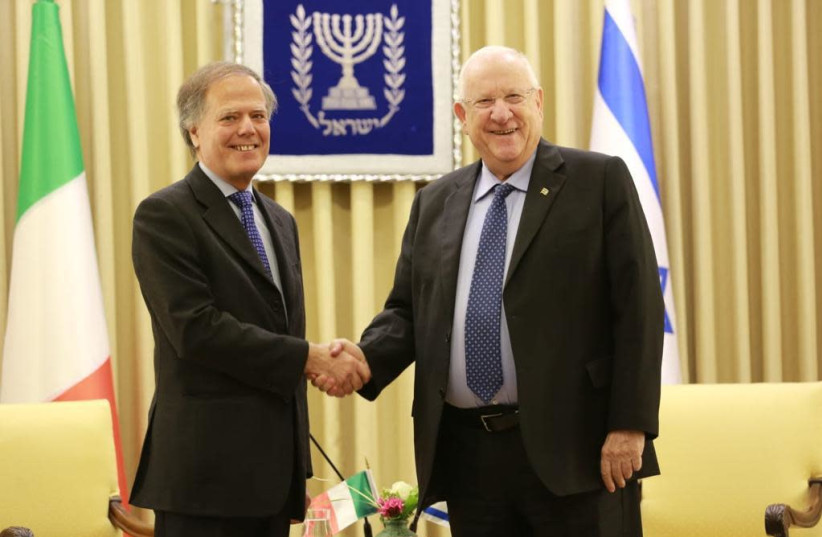 President Reuven Rivlin (R) shakes hands with Italian Foreign Minister Enzo Moavero Milanesi (L), January 28th, 2019 (photo credit: ITALIAN EMBASSY)