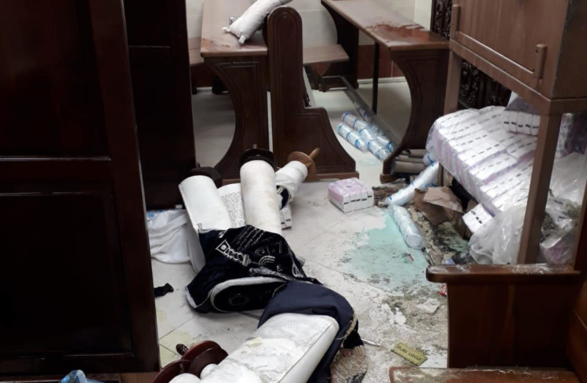 Torah scrolls strewn across the floor after the vandalism of a Jerusalem synagogue, January 29th, 2019 (photo credit: Courtesy)