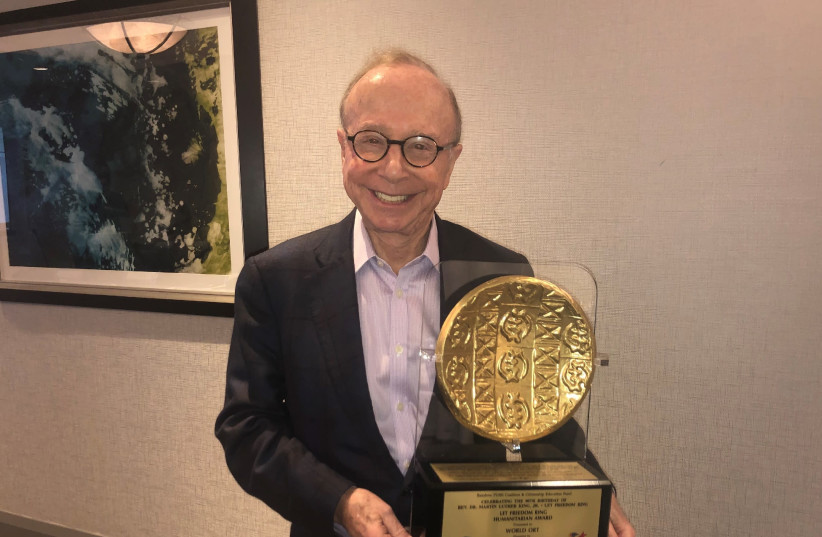 WORLD ORT president Dr. Conrad Giles holds the ‘Let Freedom Ring Humanitarian Award’ (photo credit: Courtesy)