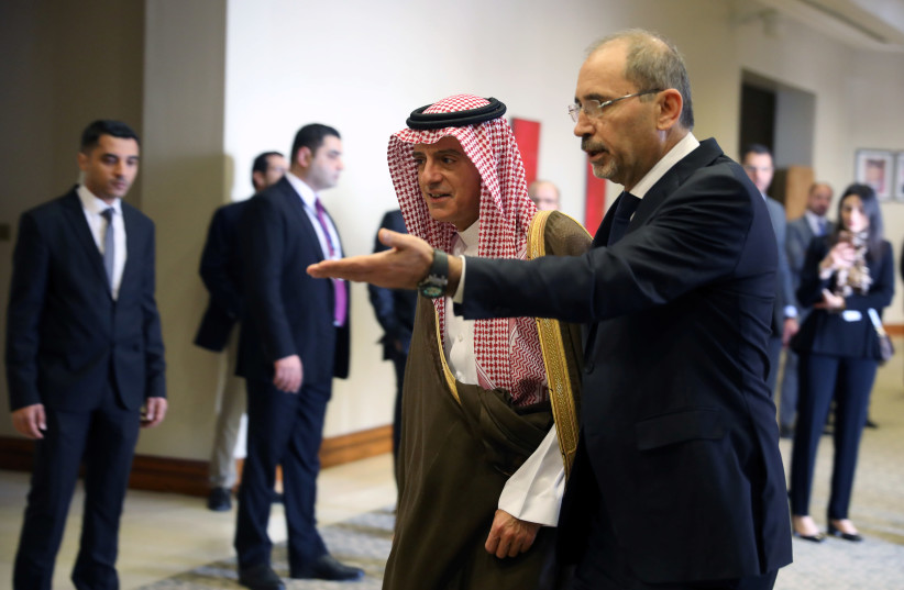 Jordanian Foreign Minister Ayman Safadi welcomes Saudi Minister of State for Foreign Affairs Adel al-Jubeir ahead of informal talks between Arab foreign ministers on the latest regional developments at the King Hussein Convention Centre at the Dead Sea, Jordan January 31, 2019. (photo credit: MUHAMMAD HAMED / REUTERS)