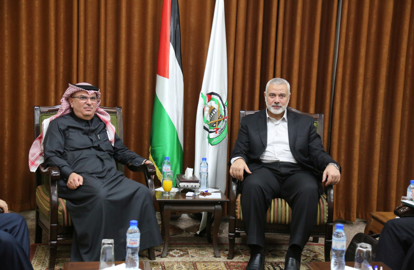 Hamas Chief Ismail Haniyeh meets with Qatari envoy Mohammed Al-Emadi in Gaza City January 24, 2019. Ahmed Shaat/Courtesy of Hamas Chief Media  (photo credit: HANDOUT/REUTERS)