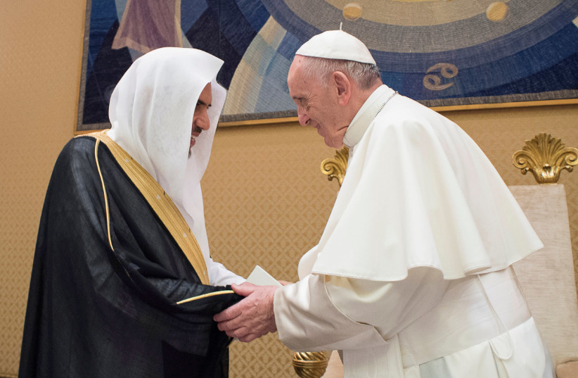 Pope Francis greets Mohammad bin Abdul Karim Al-Issa, Secretary General of the Muslim World League, during a meeting at the Vatican, September 20, 2017 (photo credit: VATICAN PHOTO SERVICE)