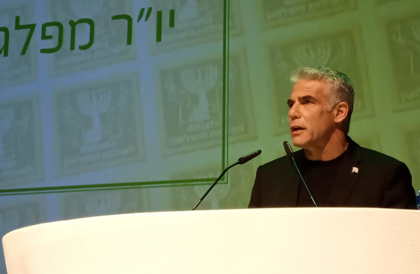 Yesh Atid leader Yair Lapid speaking at the Movement for Quality Government in Israel conference (photo credit: MOVEMENT FOR QUALITY GOVERNMENT IN ISRAEL)