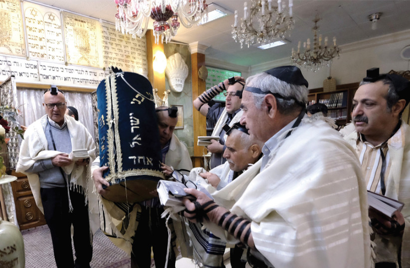 Iranian Jews pray at the Abrishami synagogue on Palestine Street in Tehran (photo credit: REUTERS/RAHEB HOMAVANDI/TIMA)
