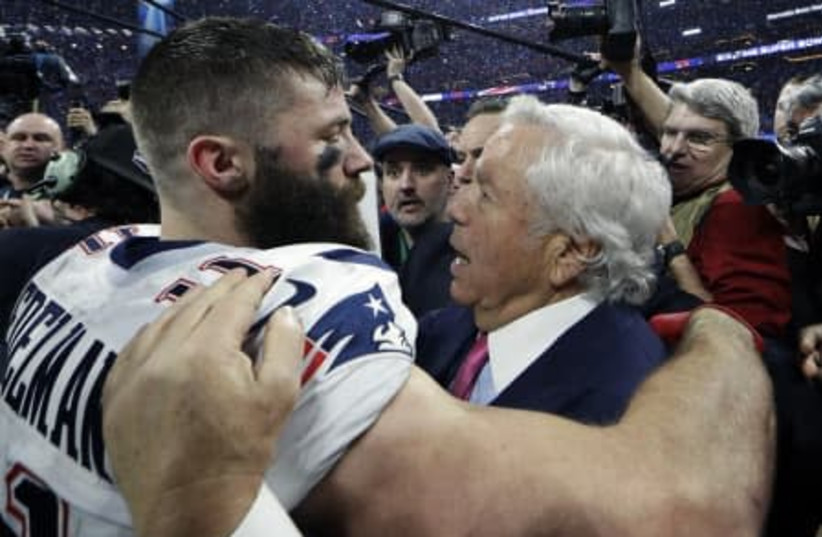 Robert Kraft embracing Julian Edelman in celebration after winning the 53rd Super Bowl. (photo credit: Courtesy)