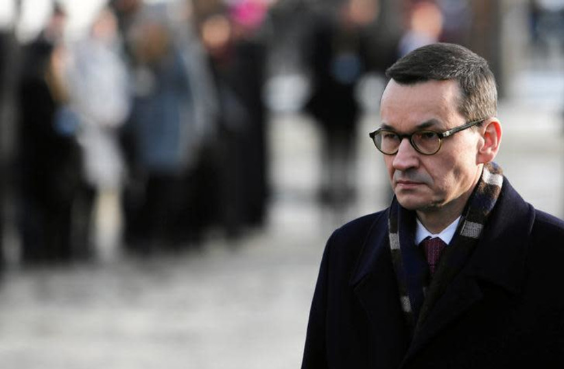 Polish Prime Minister Mateusz Morawiecki attends a commemoration event at the former Nazi German concentration and extermination camp Auschwitz II-Birkenau, during the ceremonies marking the 74th anniversary of the liberation of the camp and International Holocaust Victims Remembrance Day (photo credit: REUTERS)