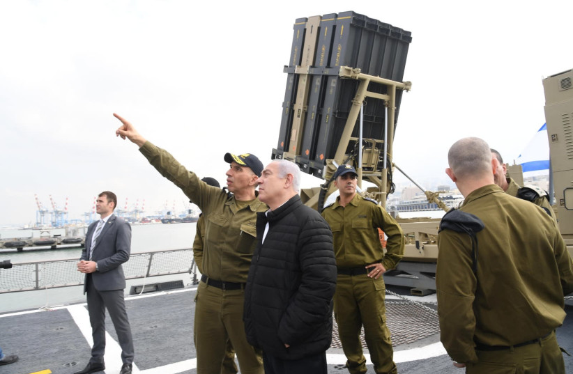 Prime Minister Benjamin Netanyahu (C-R) is briefed by Maj.-Gen. Eli Sharvit (C-L), chief of Israel's navy, February 12th, 2019 (photo credit: HAIM ZACH/GPO)