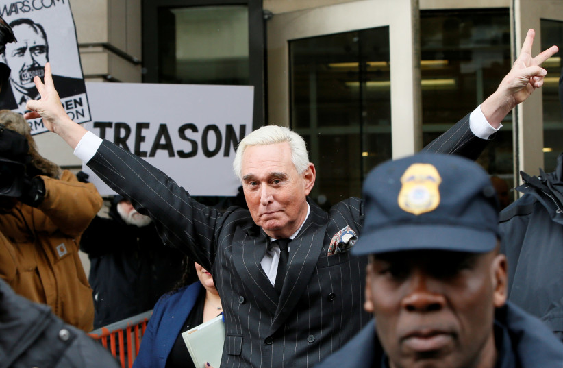 Roger Stone, longtime political ally of U.S. President Donald Trump, flashes a victory gesture as he departs following a status conference in the criminal case against him brought by Special Counsel Robert Mueller at U.S. District Court in Washington, U.S., February 1, 2019. (photo credit: JIM BOURG / REUTERS)