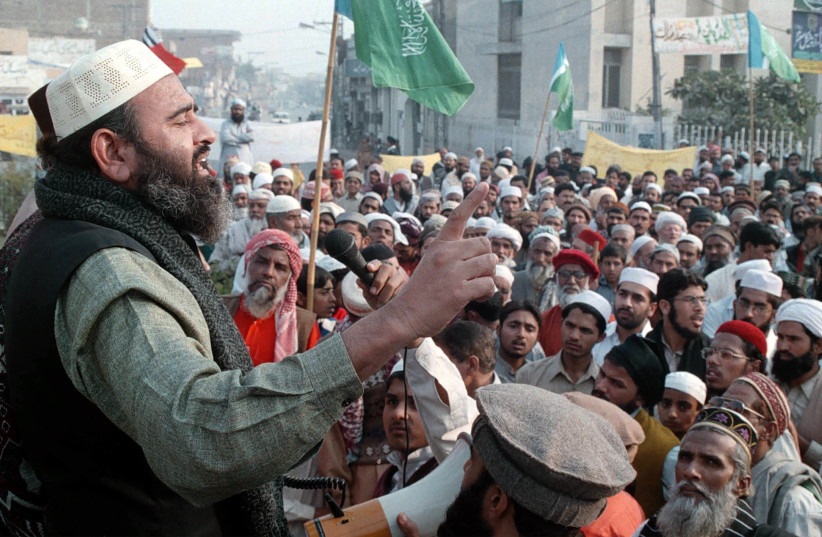 Supporters of the banned Islamic militant group Jaish-e-Mohammed stage a rally in Multan for the release of their leader Maulana Azhar Masood on December 28, 2001 (photo credit: ASIM TANVEER/REUTERS)