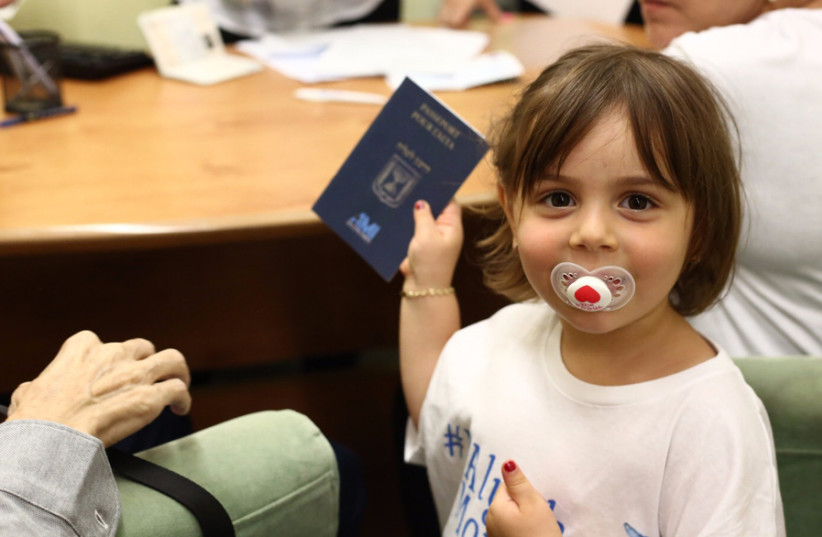A young French immigrant on arrival at Ben-Gurion Airport (photo credit: JAFI)