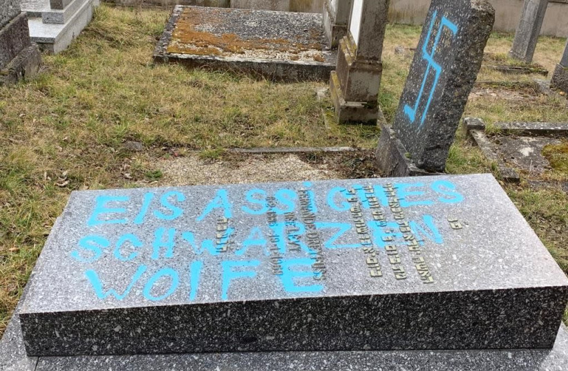 Gravestones at the Jewish cemetery in Quatzenheim, France vandalized with Nazi graffiti, February 19, 2019 (photo credit: CONSISTOIRE OF THE LOWER RHINE)