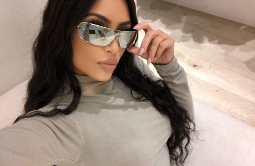 Kim Kardashian West shows off her Carolina Lemke sunglasses.  (photo credit: KRONUSSTUDIO)