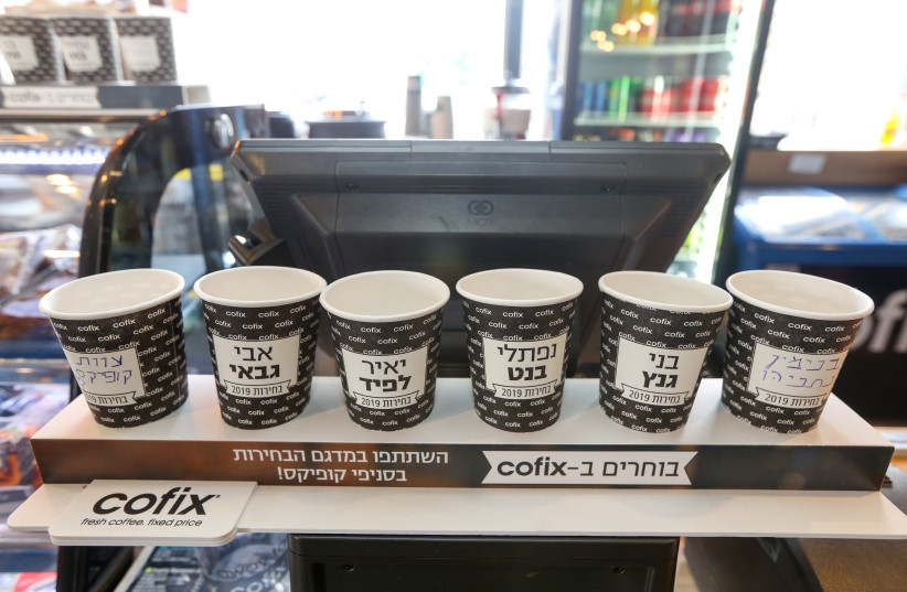 Popular budget coffee chain Cofix is holding their own poll of who will be the next prime minister using coffee cups, 2019. (credit: MARC ISRAEL SELLEM)