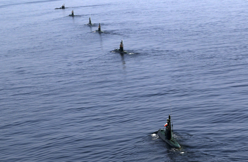 Iranian submarines participate in a naval parade on the last day of the Velayat-90 war game in the Sea of Oman near the Strait of Hormuz in southern Iran January 3, 2012 (photo credit: REUTERS)