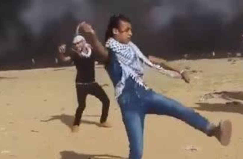 Palestinians dance on the Gaza border. (photo credit: screenshot)