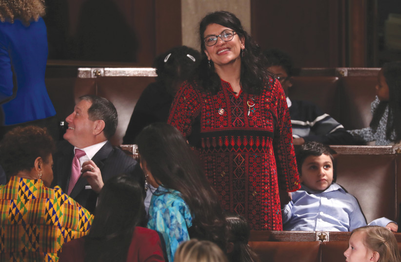 US REPRESENTATIVE Rashida Tlaib looks up into the gallery during the first session of the new Congress at the US Capitol in Washington in January (photo credit: REUTERS)