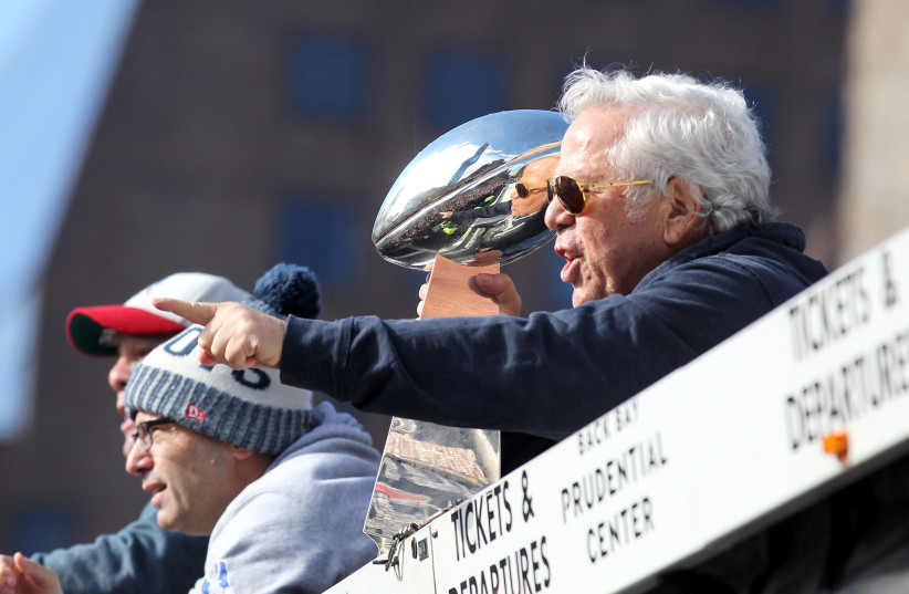Boston, MA, USA; New England Patriots owner Robert Kraft thanks fans as he holds the Lombardi Trophy during the Super Bowl LIII championship parade (photo credit: STEW MILNE-USA TODAY SPORTS)