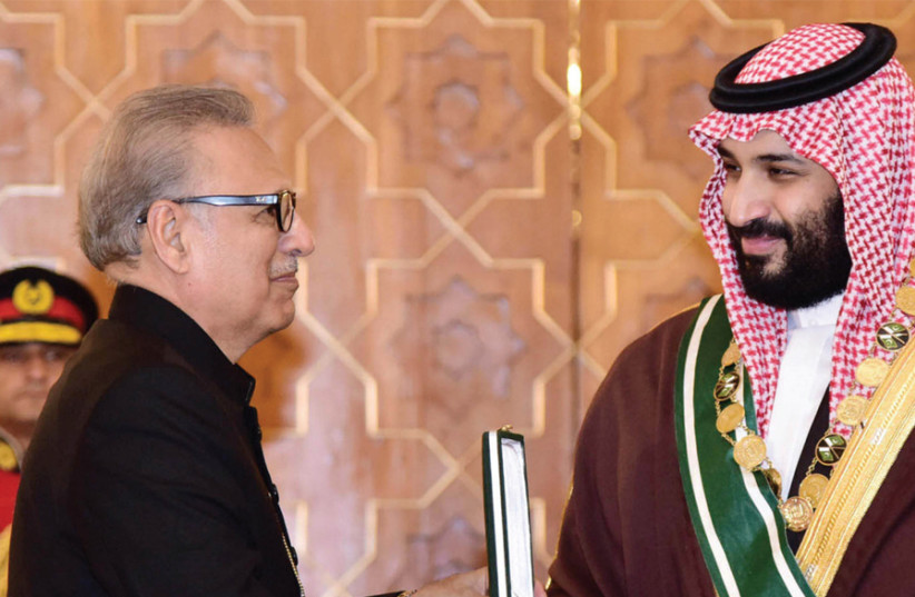 PAKISTANI PRESIDENT Arif Alvi (left) bestows his country’s highest civil award, Nishan-e-Pakistan, to Saudi Arabia’s Crown Prince Mohammed bin Salman at the President House in Islamabad on February 18. (photo credit: REUTERS)