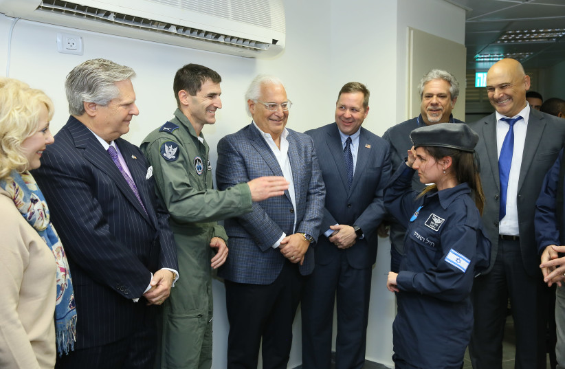 Ambassador David Friedman greets a soldier from the IDF's Special in Uniform program at the Palmachim Air Force Base. (photo credit: Courtesy)