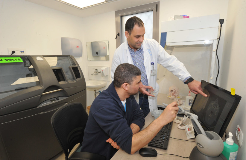Galilee Medical Center doctors use the 3D laboratory (photo credit: RONI ALBERT)