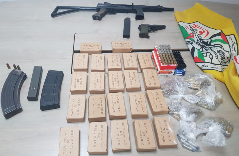 Carl Gustav rifle and assorted ammunition confiscated by Israel Police and IDF forces from Hebron, March 13, 2019. (photo credit: COURTESY POLICE SPOKESMAN’S UNIT)