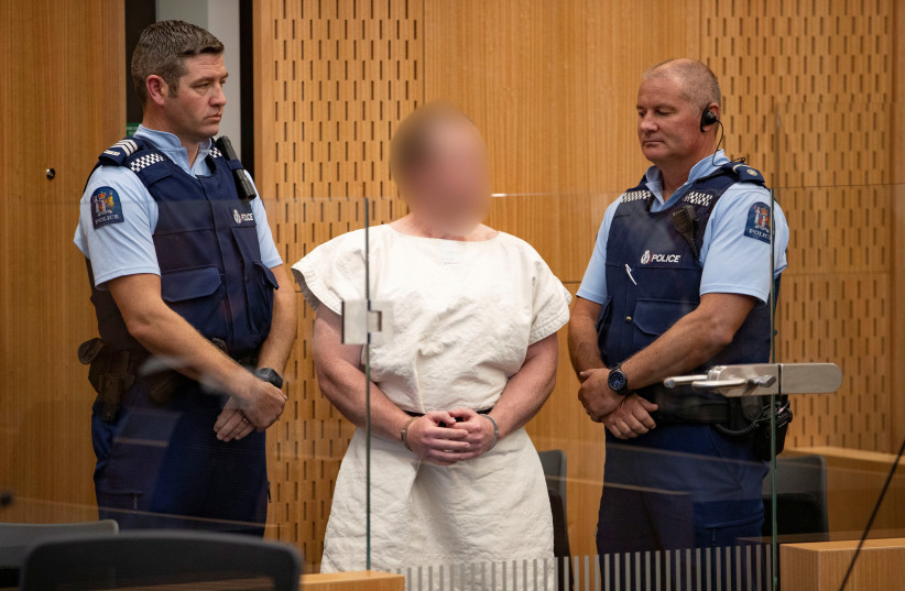Brenton Tarrant, charged for murder in relation to the mosque attacks, is seen in the dock during his appearance in the Christchurch District Court, New Zealand March 16, 2019 (photo credit: MARK MITCHELL/NEW ZEALAND HERALD/POOL VIA REUTERS)